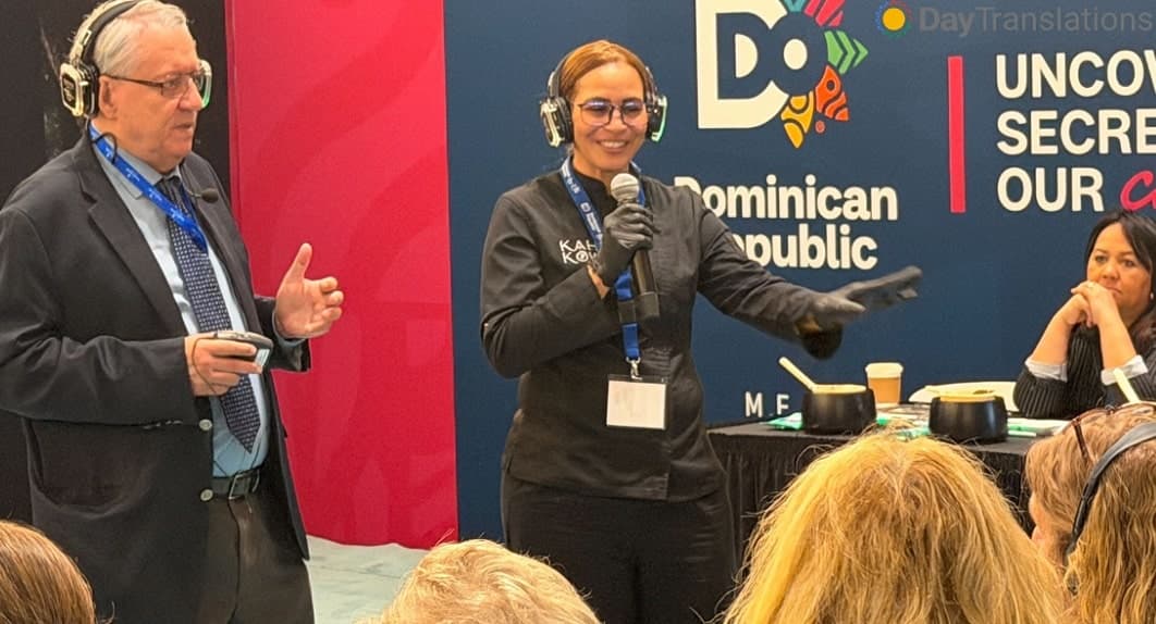 Interpreter alongside the chef during the live cacao demonstration